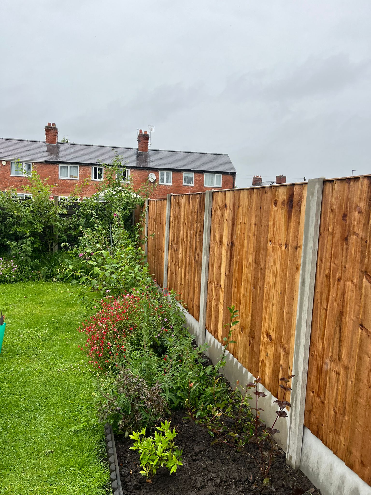 Newly installed timber fencing along a residential boundary